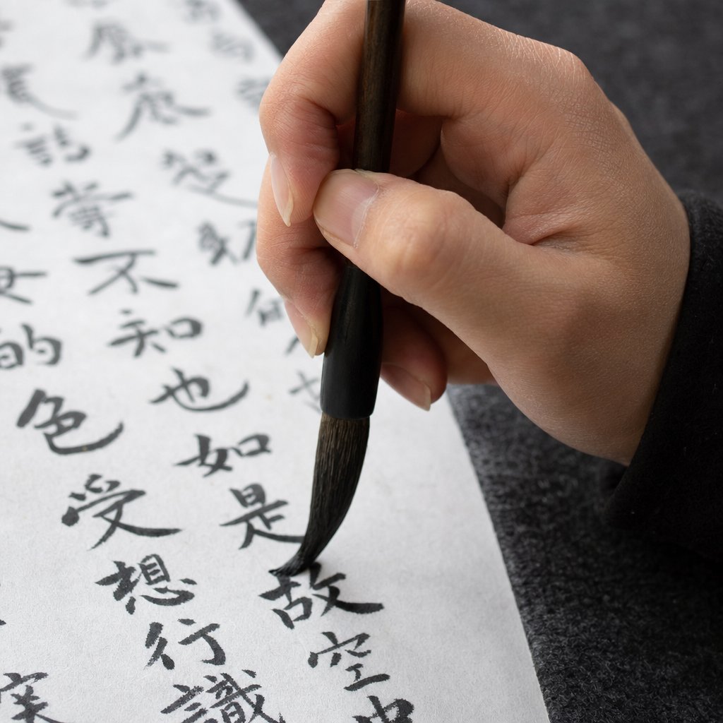 practicing regular script calligraphy with precise brush control on traditional xuan paper